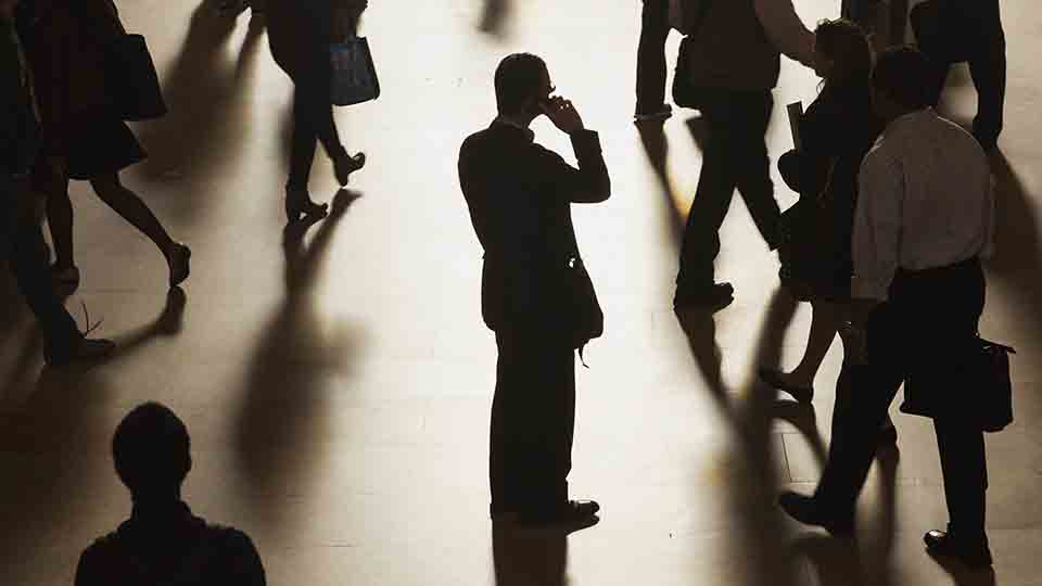 A man stands in the middle of Grand Central Terminal as he speaks on a cell phone, as passengers face limited train service on the New Haven Line between Stamford Station and Grand Central Terminal due to a Con Edison power problem in New York, September 25, 2013.