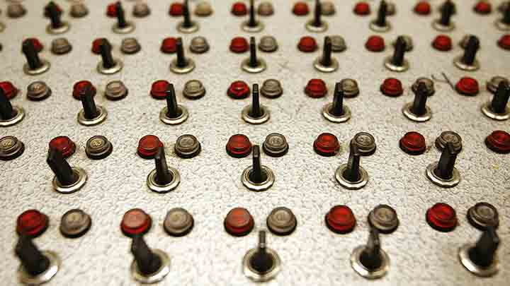 Switches of a sound control, dating from the 70s, are pictured on a desk in the Room XVIII at the European headquarters of the United Nations in Geneva June 30, 2008.
