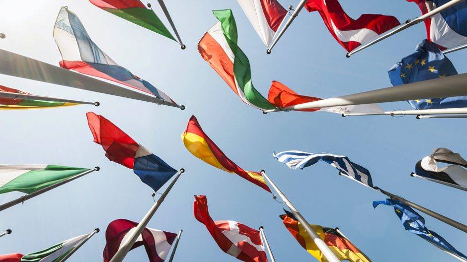 Looking up at flags of many nations